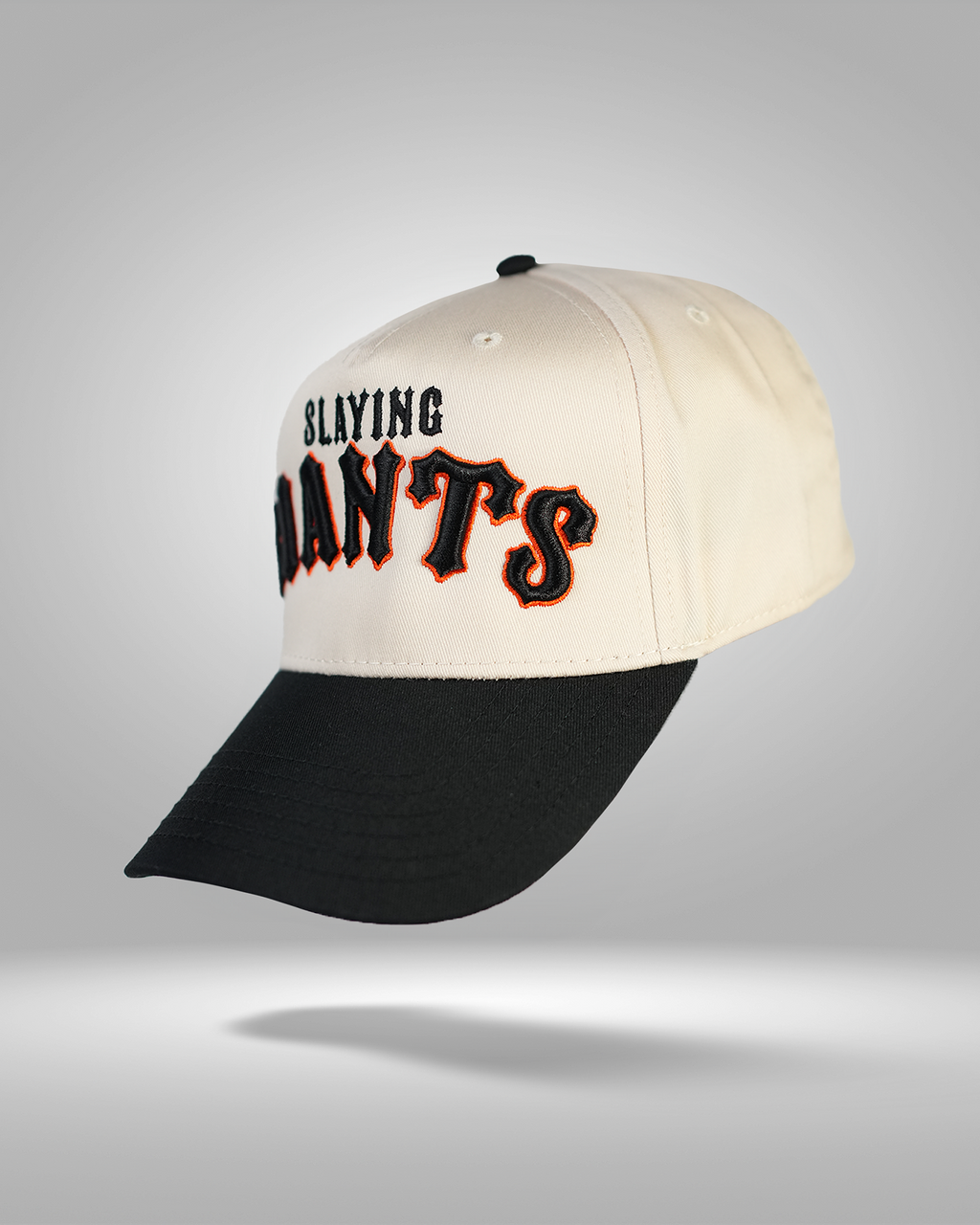 CreamBlackOrangeSlayingGiantsChristlikeLeftFacing1.png