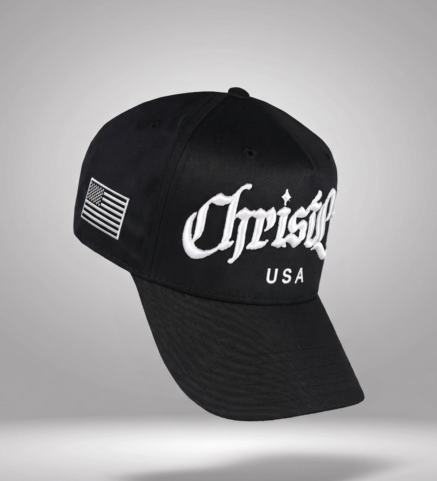 Black cap with 'Christlike USA' logo on a gray background