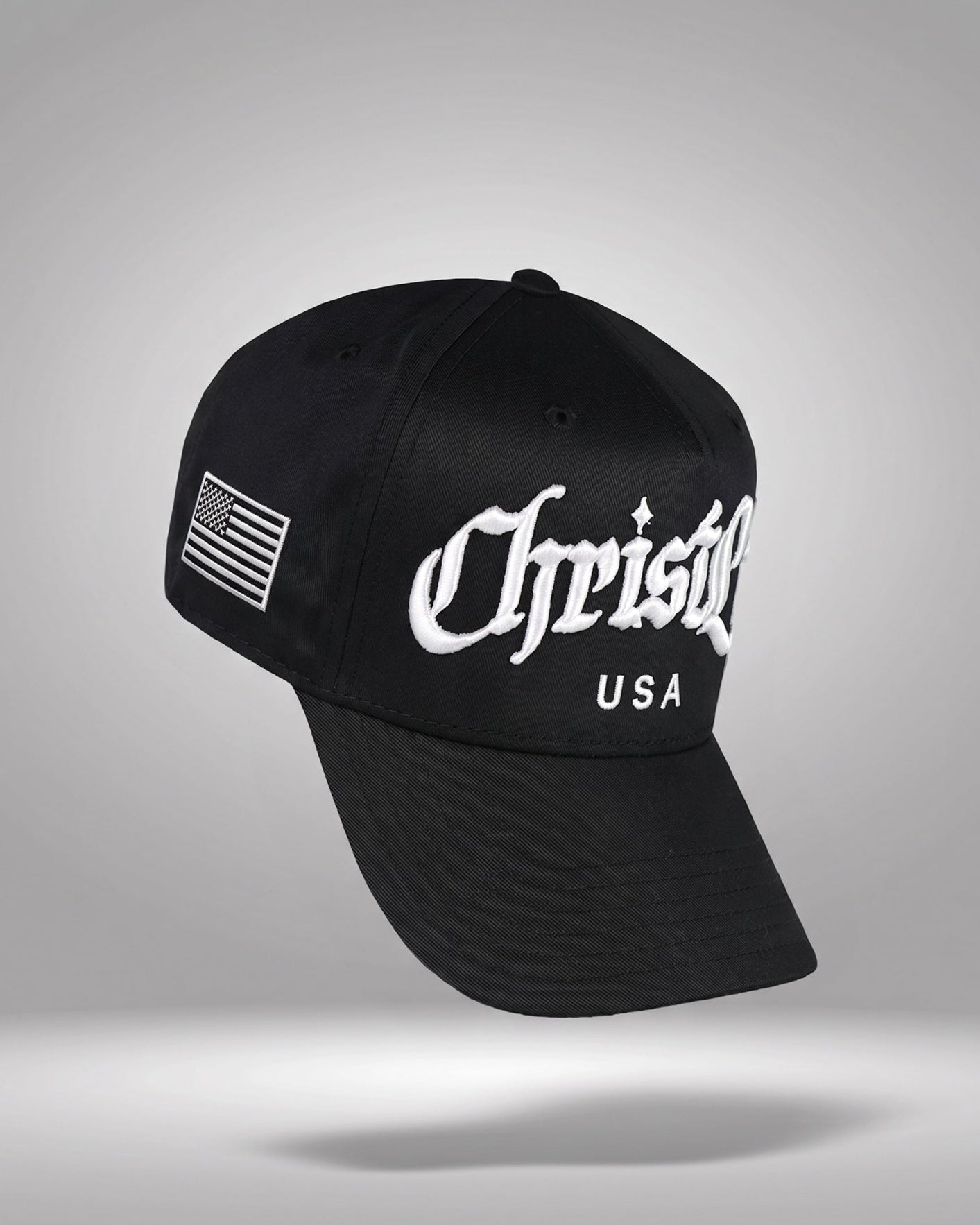 Black cap with 'Christlike USA' logo on a gray background
